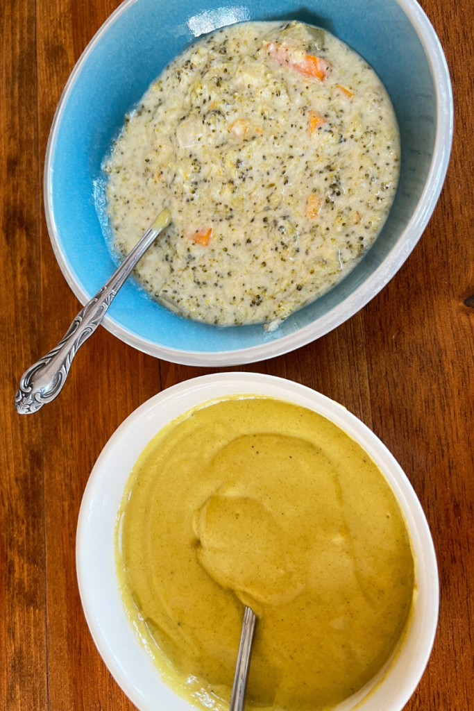 two bowls of soup on a table, first bowl is a chunky broccoli cheddar soup and the second bowl is of the same soup pureed to a smooth consistency